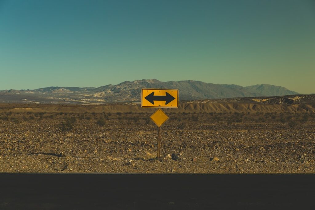 Road sign pointing in two different directions representing redirects