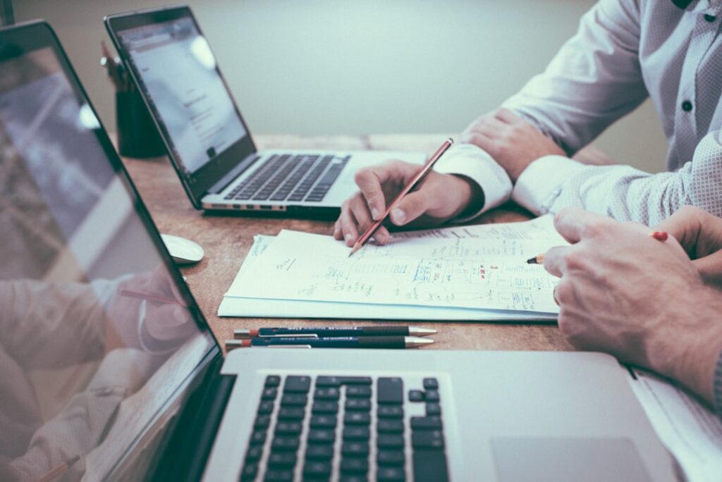 Business owner reviewing monthly progress notes and planning ahead