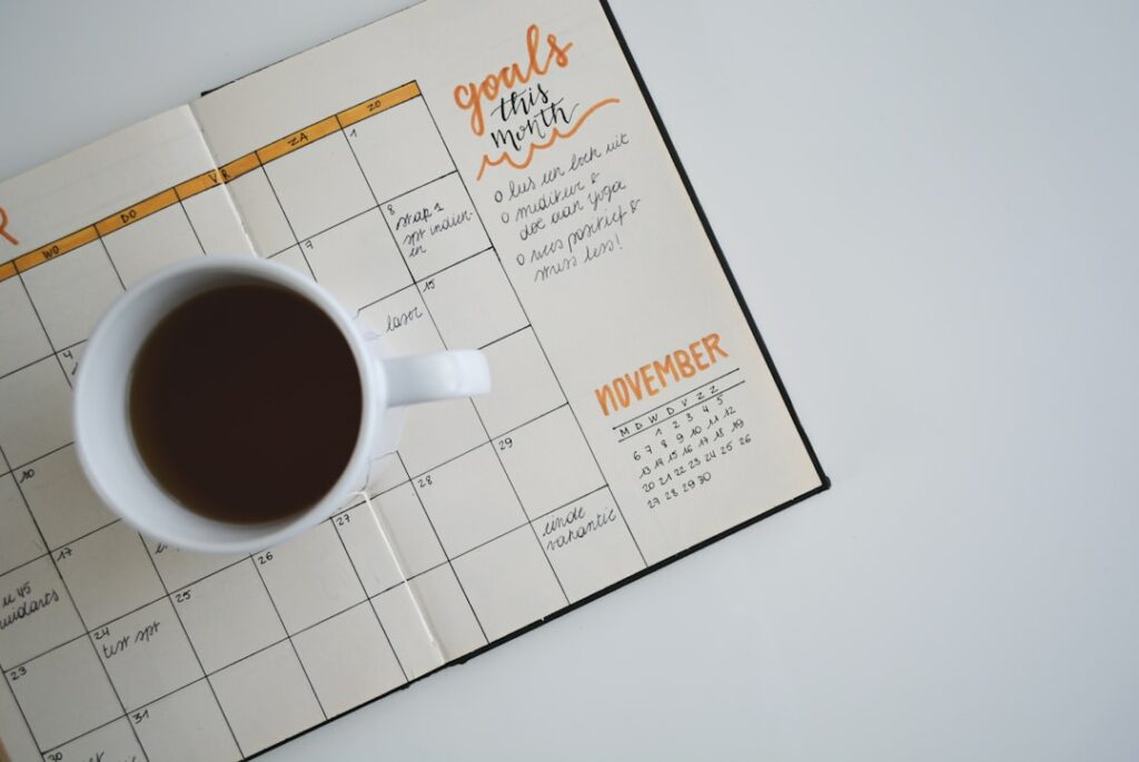 Planner with coffee cup representing seasonal content planning